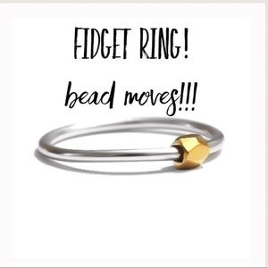 Silver and gold colored fidget/anxiety ring.